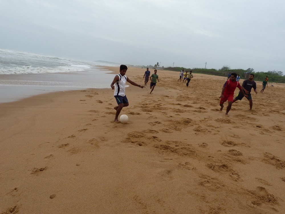 Playing Football on the beach in Goa