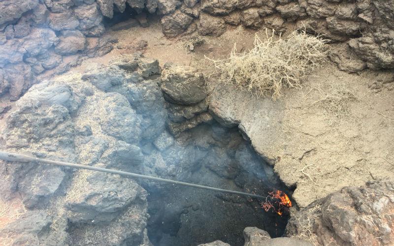 A natural fire from volcano heat in Timanfaya National Park