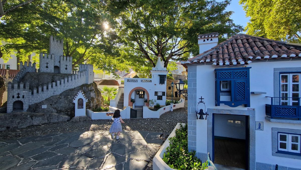My daughter exploring the small, traditional houses that make up Little Portugal in Coimbra.