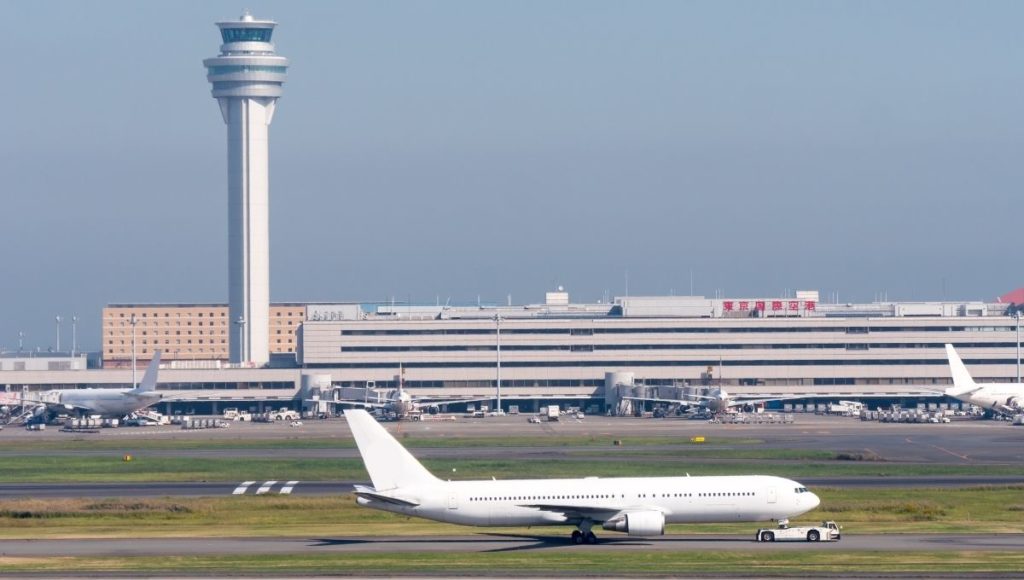 A plane on the runway at Haneda Airport in Tokyo
