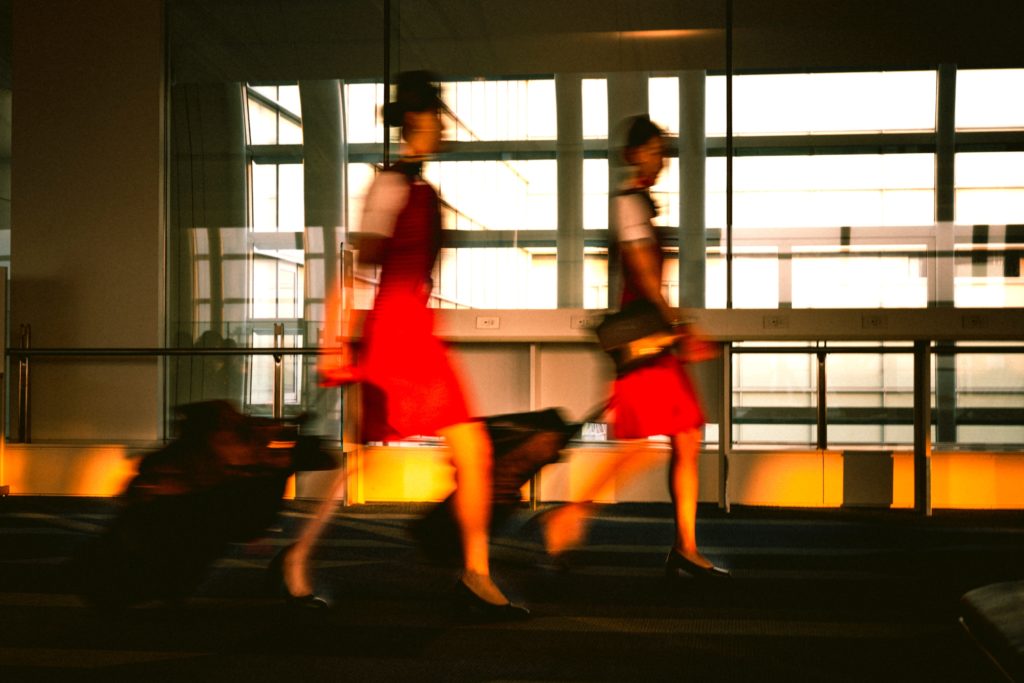 Air stewardesses walking through an airport in Tokyo