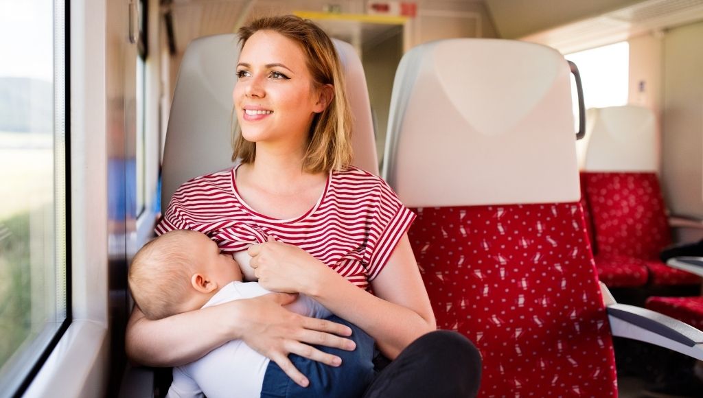 young mother travelling with baby