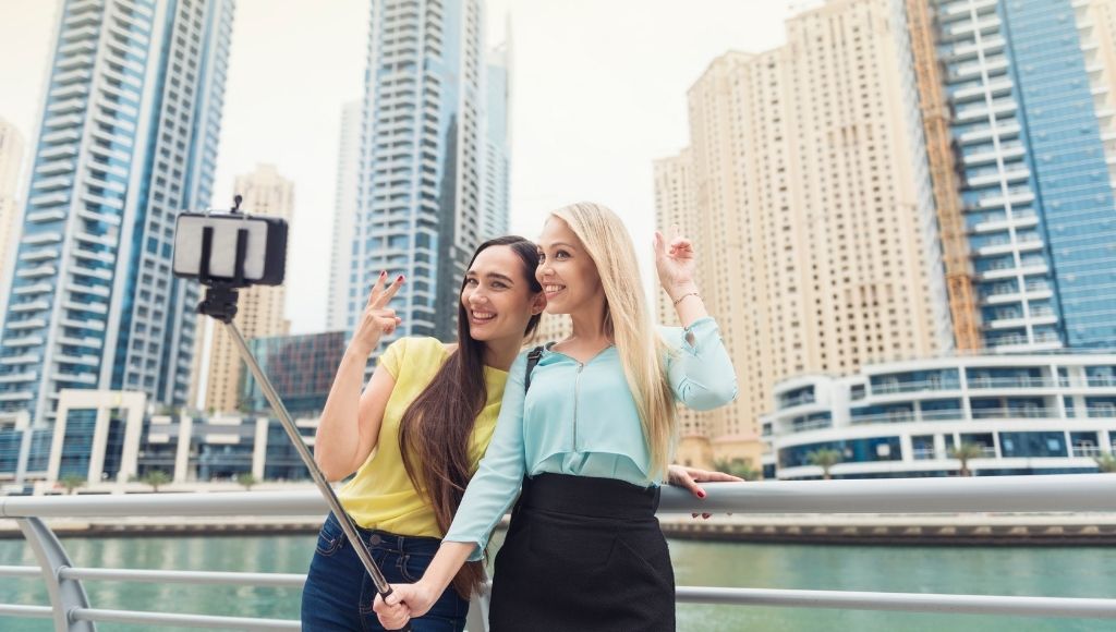 Two friends are taking selfies in dubai