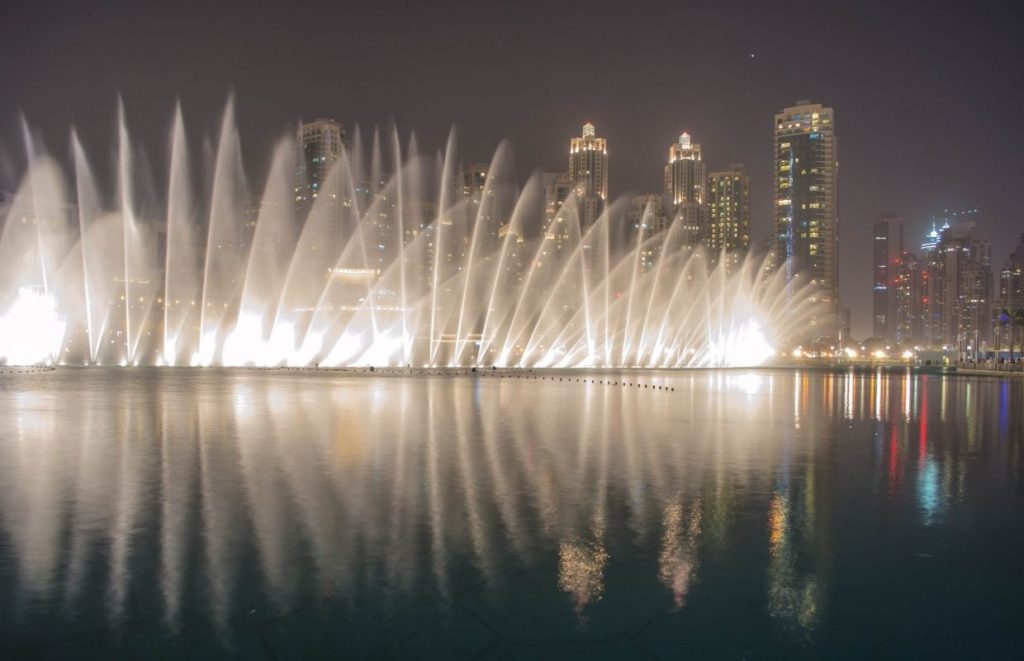 A photo of the Palm Fountains at night