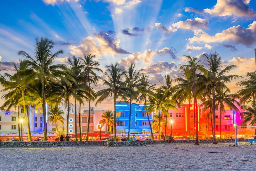 A picture of South Beach in Miami with bright lights shining at dusk