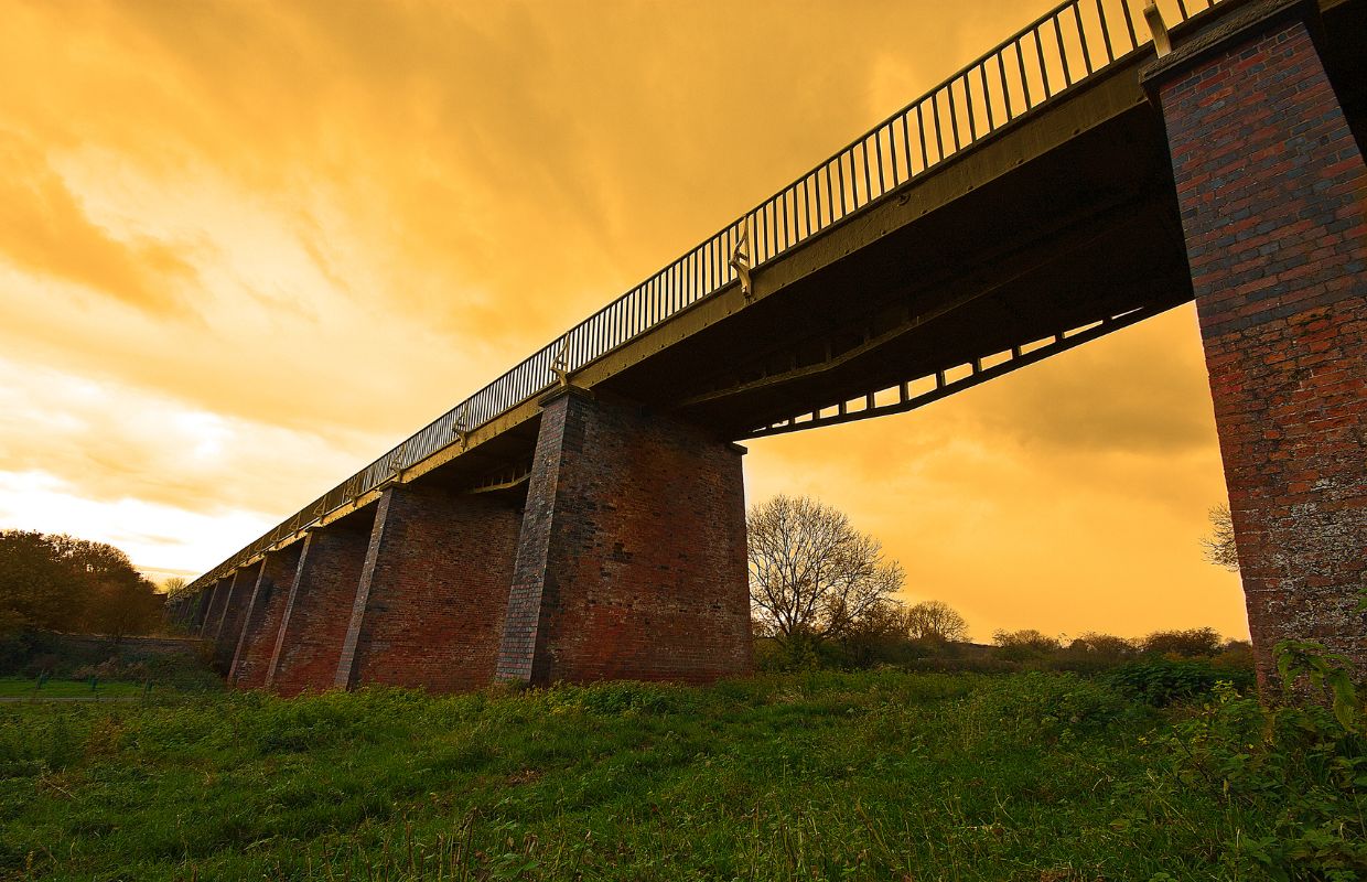 A photo looking up to the Edstone Aqueduct at sunset