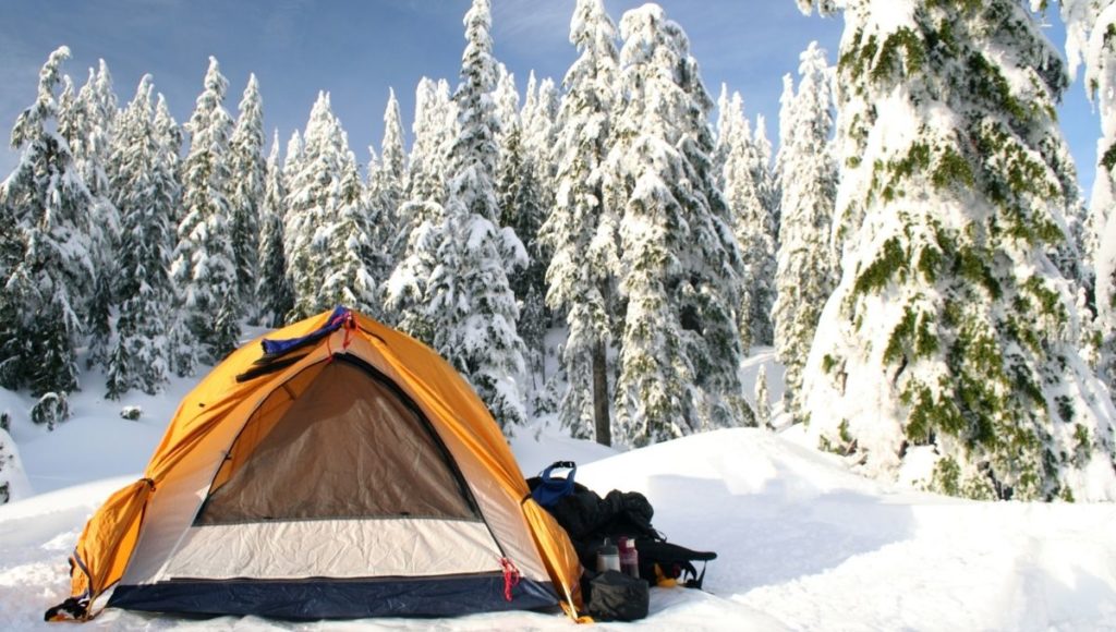 A tent setup on a cold snowy ground