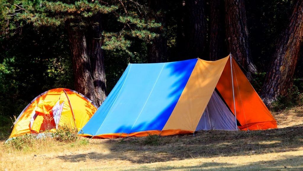 a scenario of the tarps over the top of the tents