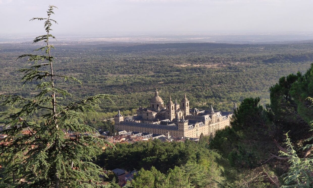 A wide angle view of the El Escorial Monastery taken from a hike in the Sierra de Guadarrama mountains