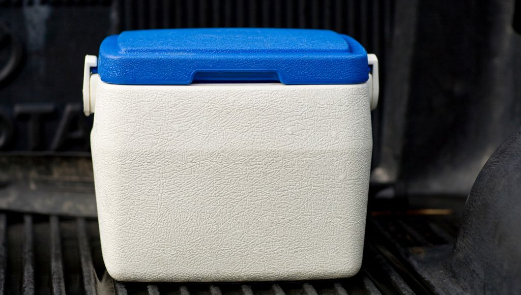 Small cooler in the back of a wet pickup truck