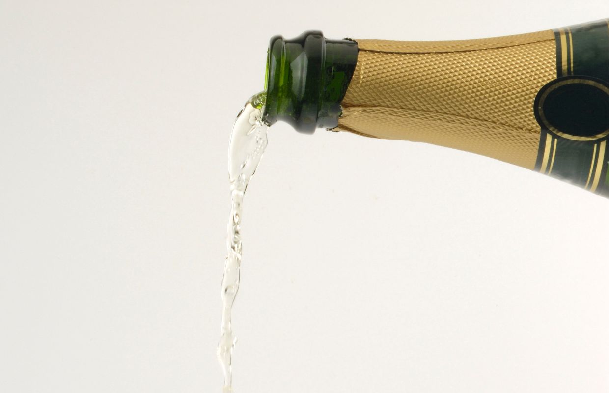 Cava being poured out of a bootle