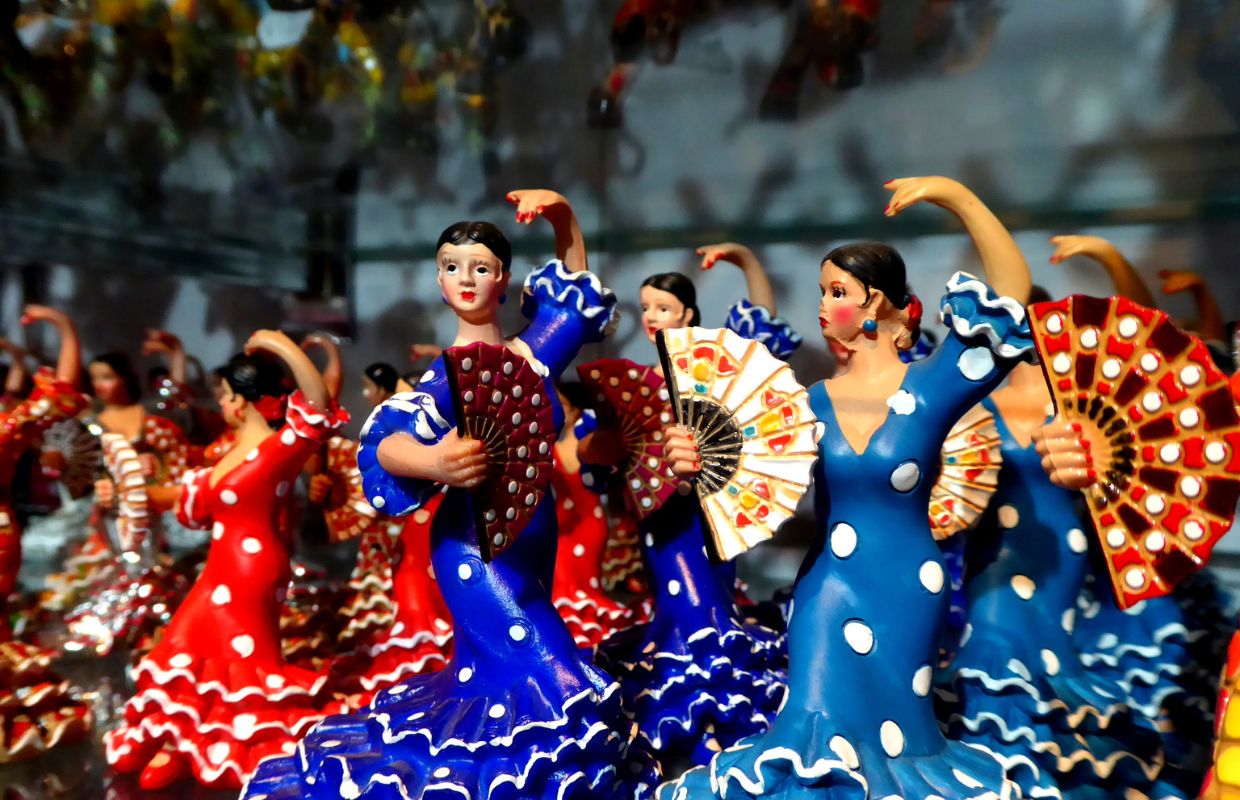 Colourful miniature porcelain flamenco figures for sales as souvenirs in Barcelona