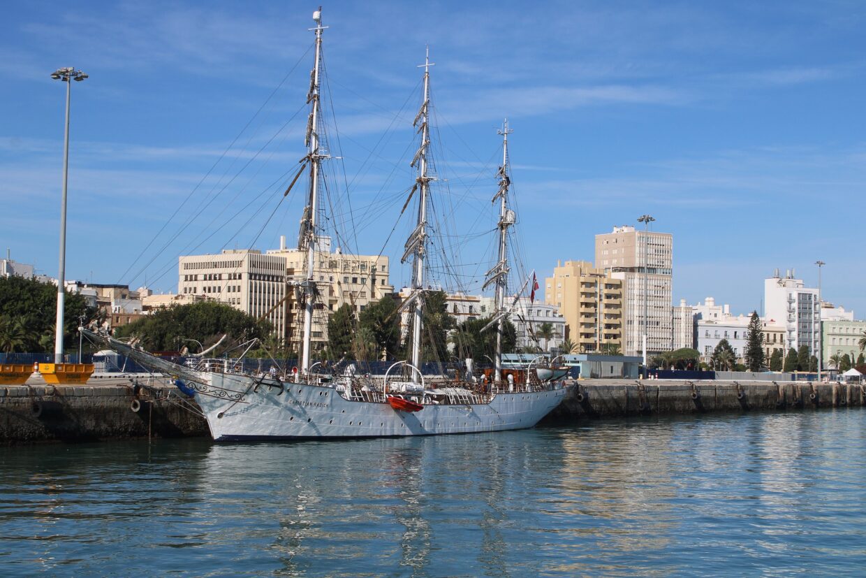 Sailboat moored in Cádiz harbor, highlighting the city's maritime charm in our Cádiz travel guide