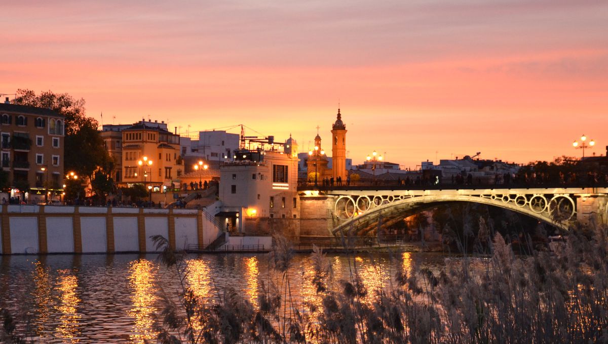 Looking to Triana from the the banks of the Guadalquivir River as the sun sets in Seville