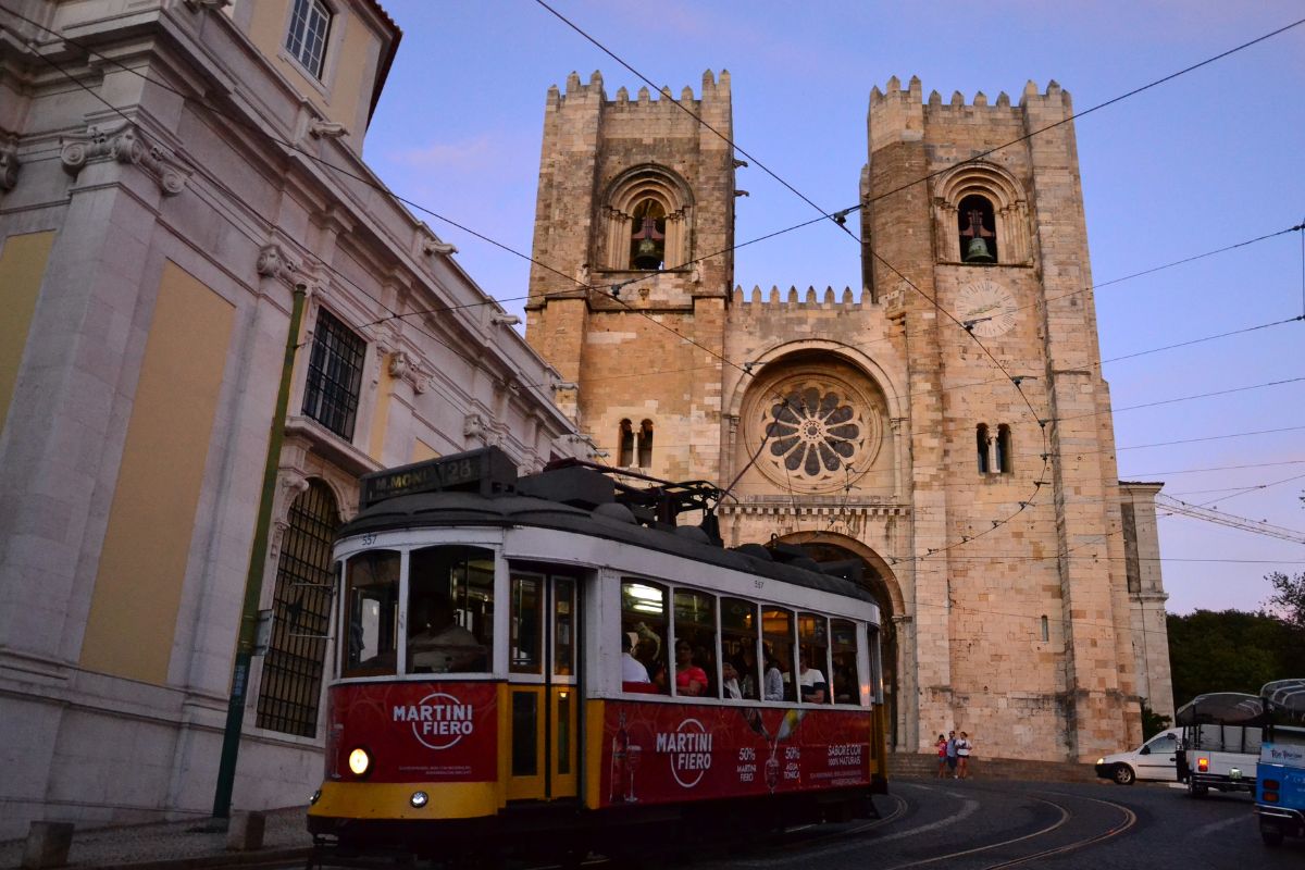 Tram passing a church in Lisbon
