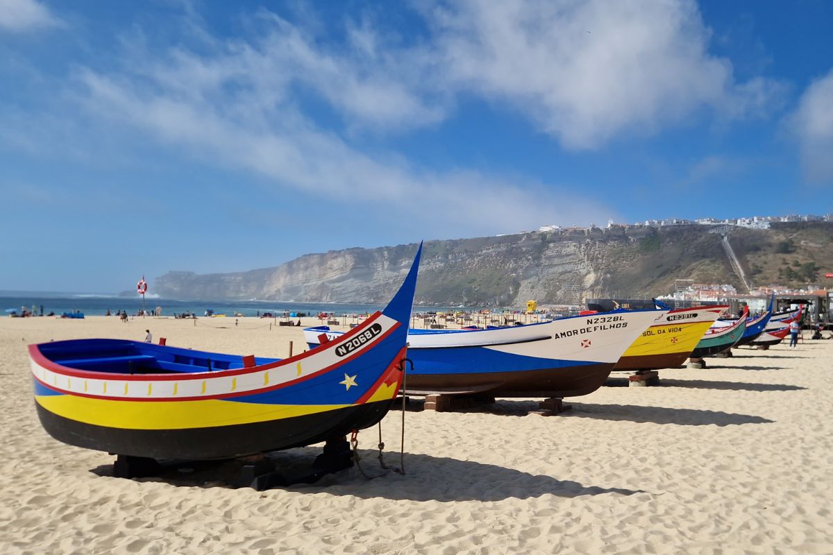 Colourful boats on the beach at Nazare in Portugal